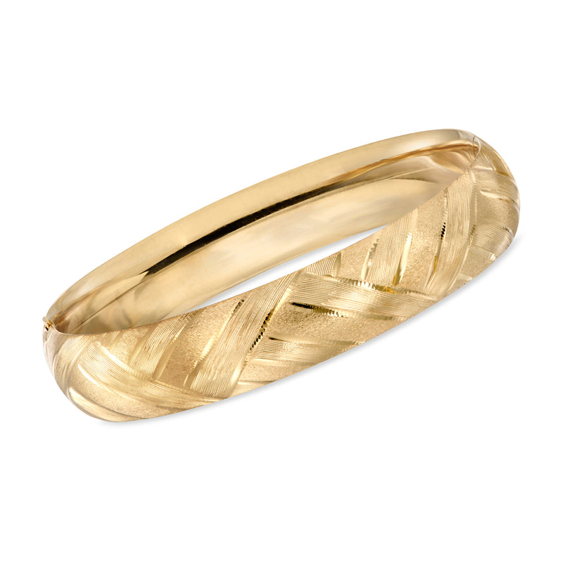 Yellow gold striped bangle bracelet with engraved wave pattern