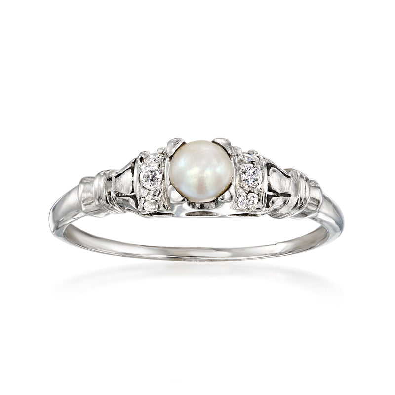 Platinum ring with round white cultured pearl and diamond accents on split shank