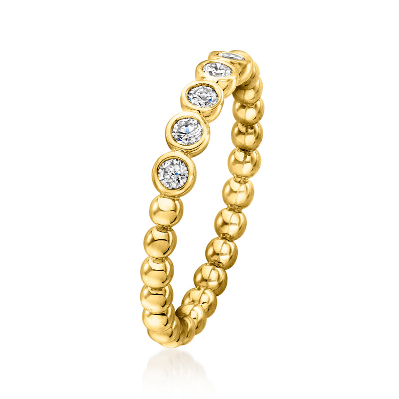 Gold beaded ring with four round bezel-set diamonds in a curved row
