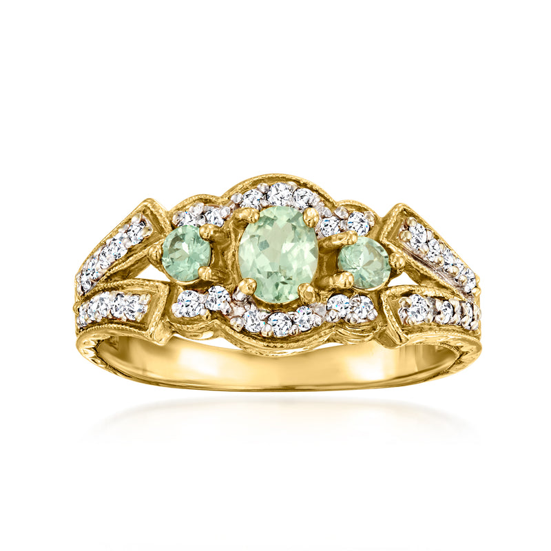 Vintage oval green sapphire and diamond ring in 14kt yellow gold.