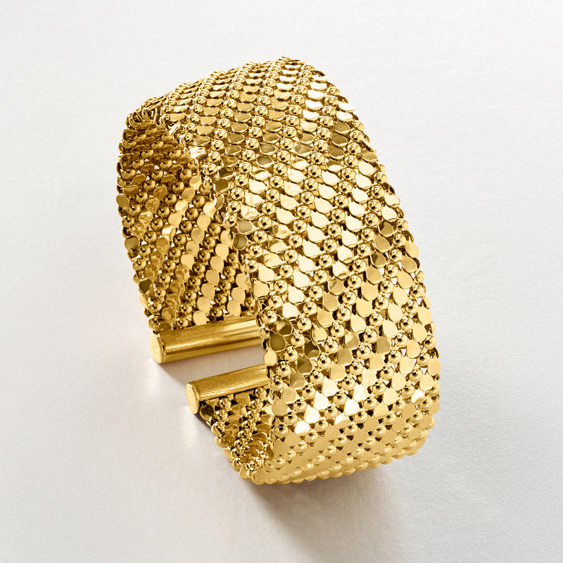 Gold-plated wide cuff bracelet with mesh bead texture and hinged closure, side view
