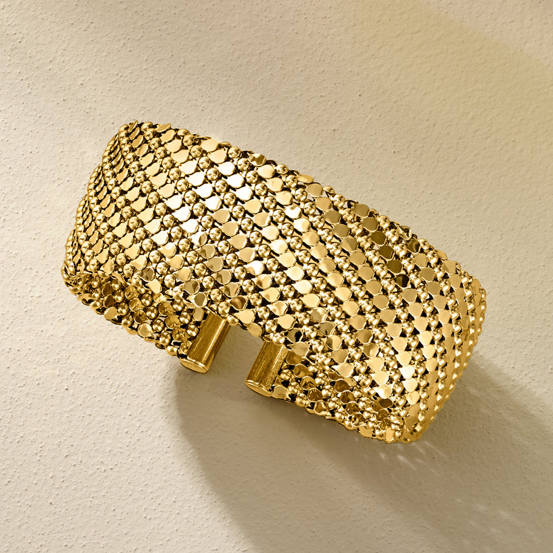 Gold-plated patterned wide cuff bracelet with dotted mesh texture and end hinge detail
