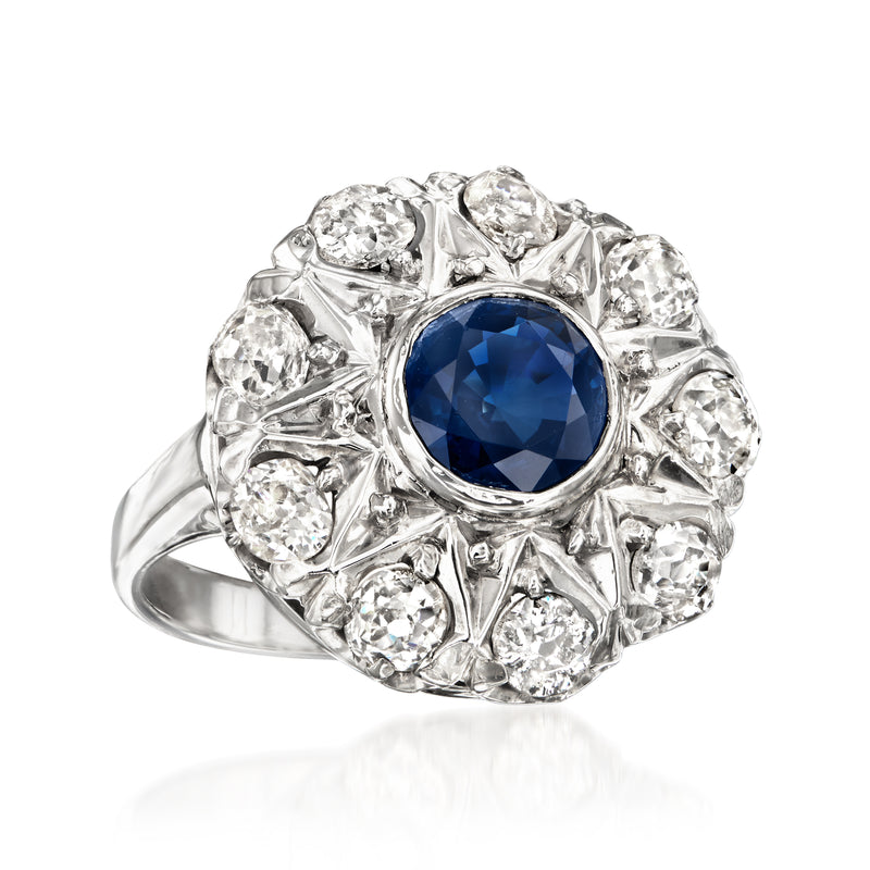 Vintage sapphire and diamond ring, blue center stone surrounded by diamond cluster