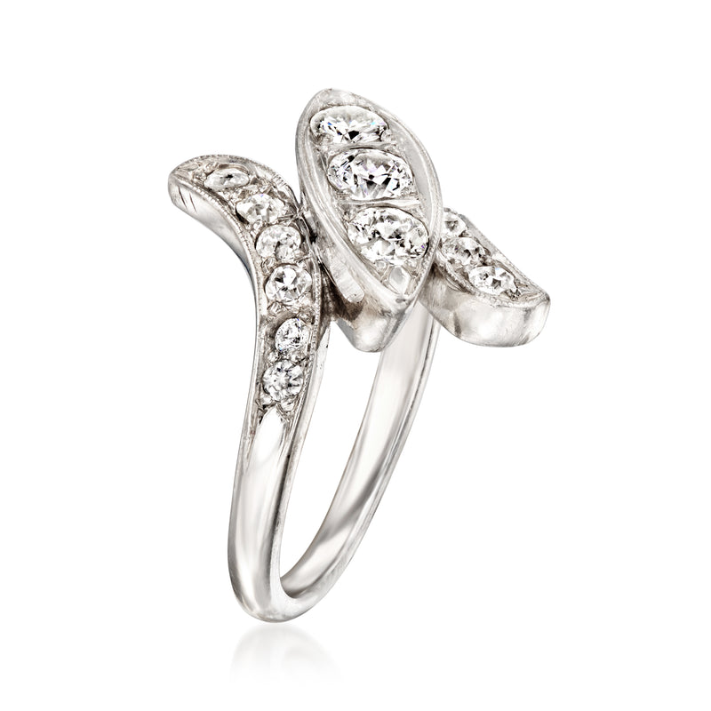 Vintage diamond bypass ring in palladium with marquise and round stone settings