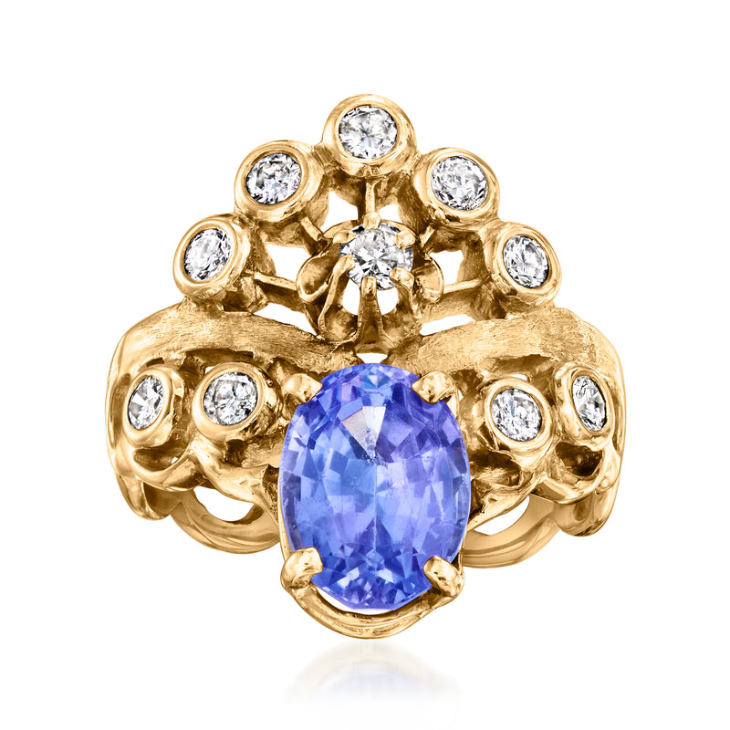 14kt yellow gold ring with oval blue gemstone and round diamond accents