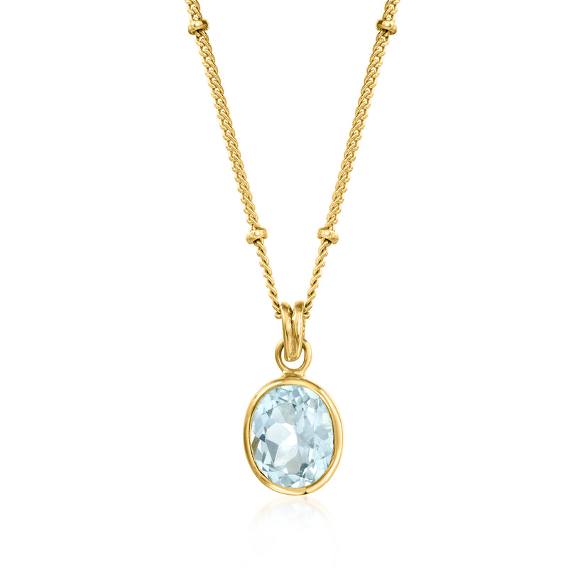 Gold-tone station necklace with oval sky-blue topaz pendant on chain