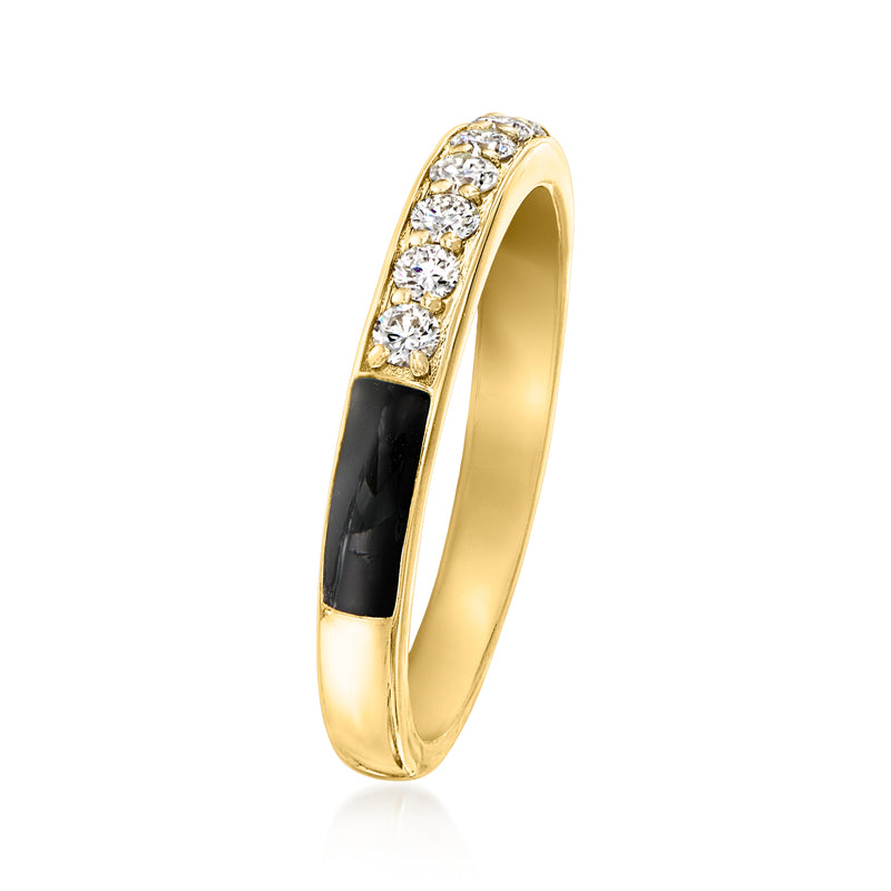 Gold-tone ring with black enamel center and diamond row along the band
