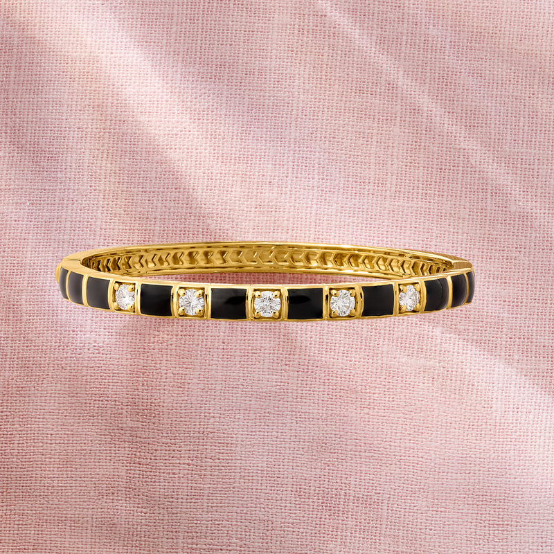 Gold bangle bracelet with black enamel stripes and round diamond bezel settings