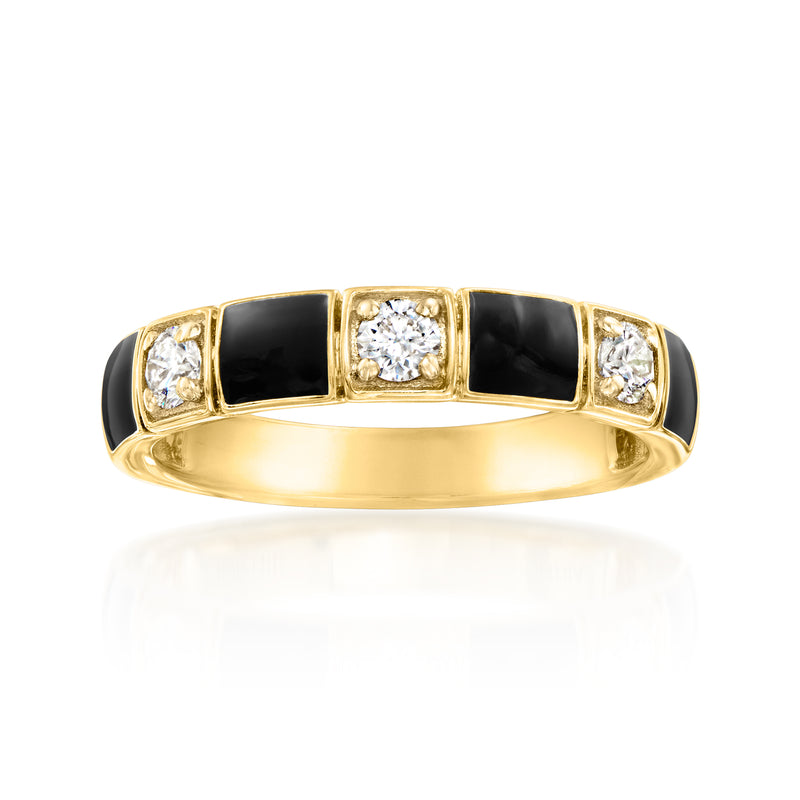 Gold-tone ring with black enamel pattern panels and four round diamond accents