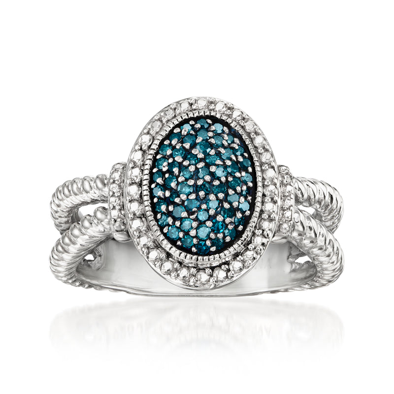 Sterling silver ring with oval blue diamond cluster and halo, twisted band