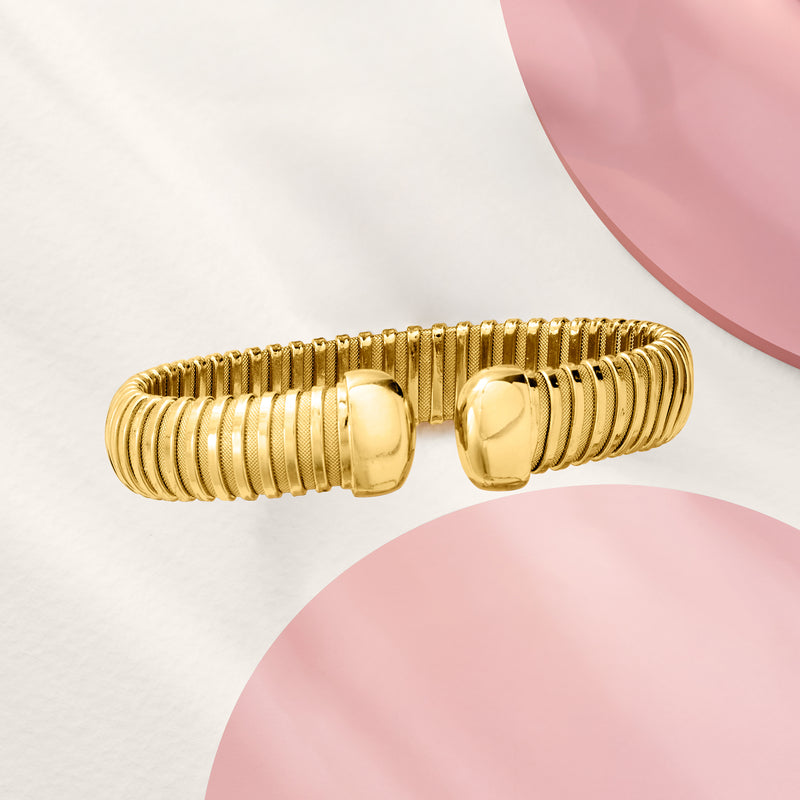 Yellow gold-plated tubogas cuff bracelet, angled view with two hinged end caps