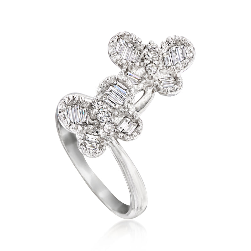 18kt white gold butterfly motif ring with baguette and round diamond clusters