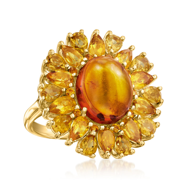 Amber cabochon citrine ring with oval center and yellow teardrop halo in gold setting