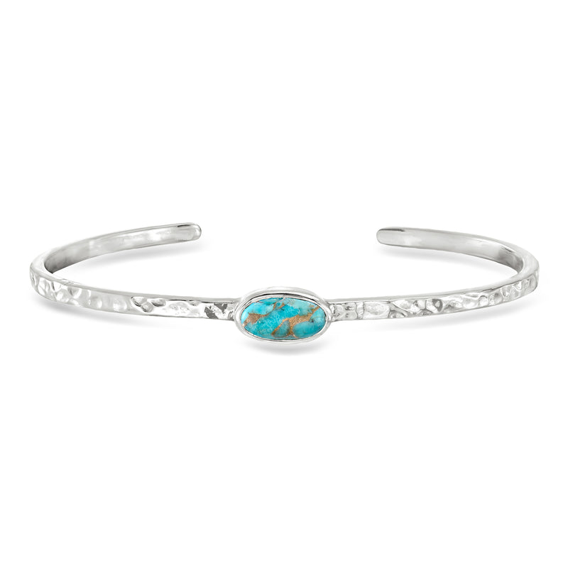 Sterling silver hammered cuff bracelet with oval turquoise stone centerpiece