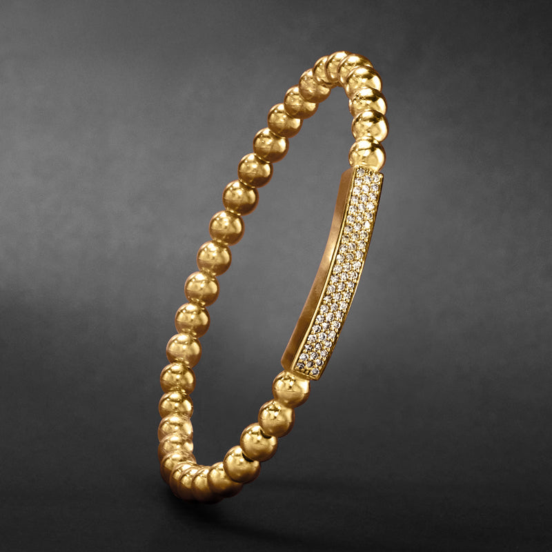 Gold beaded stretch bracelet with a diamond pavé bar