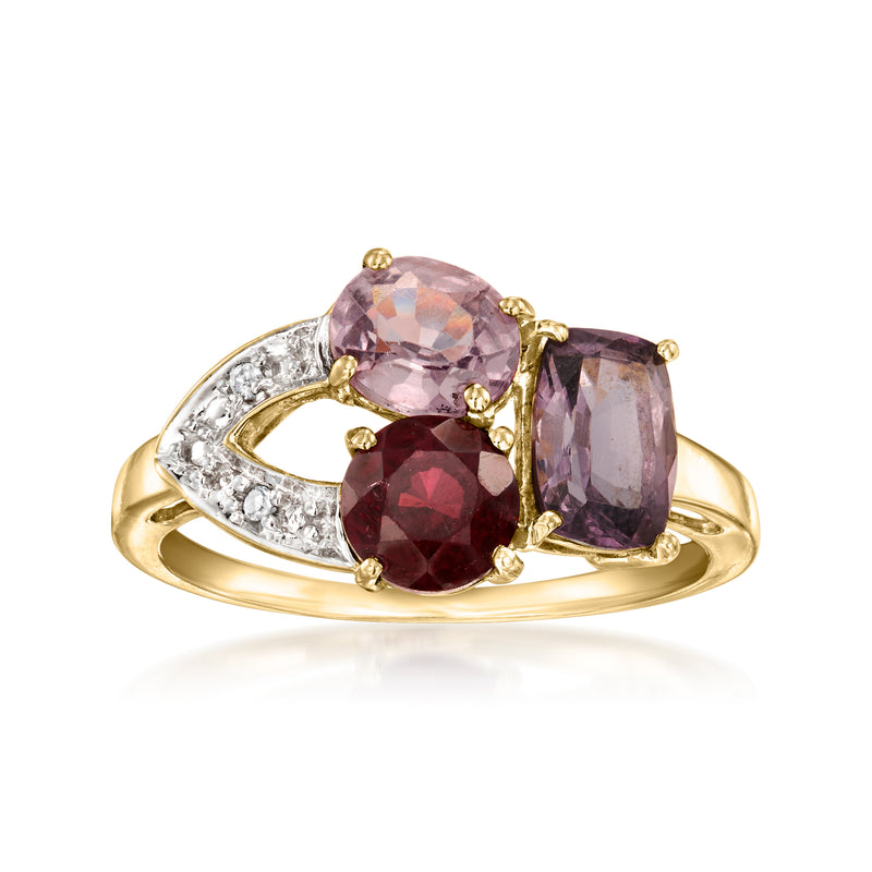 9kt yellow gold cluster ring with three oval pink, purple, and red gemstones and diamonds