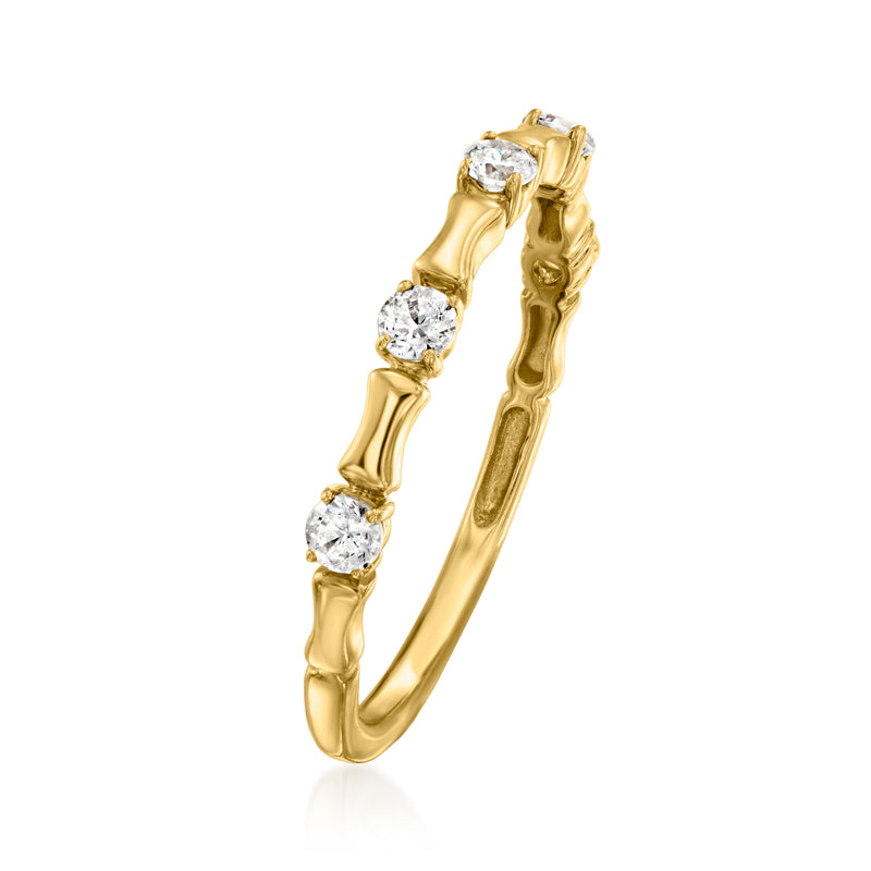 Gold diamond band ring with a series of round stones on the top