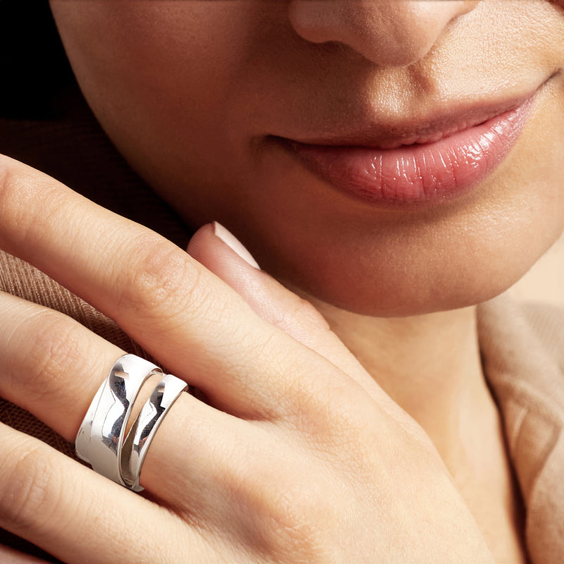Silver-plated multi-row ring worn on finger, wide polished curved bands