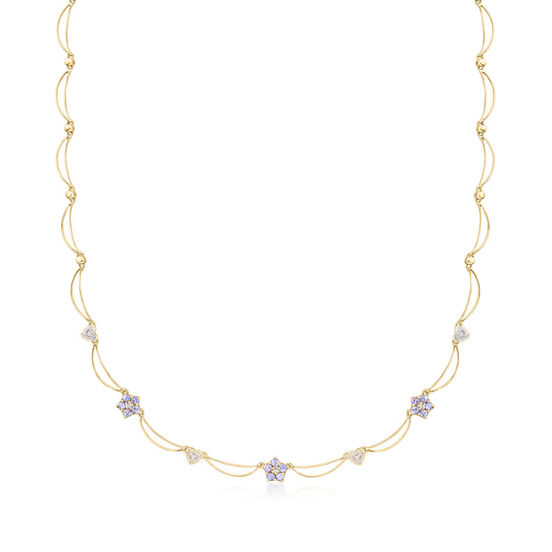 14kt yellow gold tanzanite station necklace with scalloped diamonds along the chain