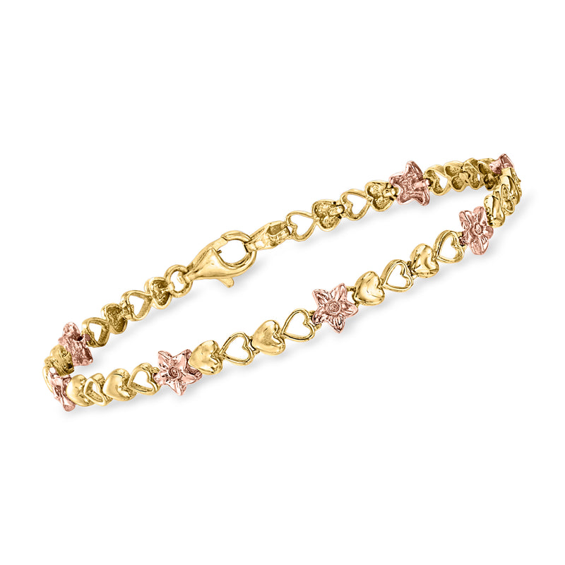 Two-tone 14kt gold bracelet with linked chain stations, heart and flower motifs