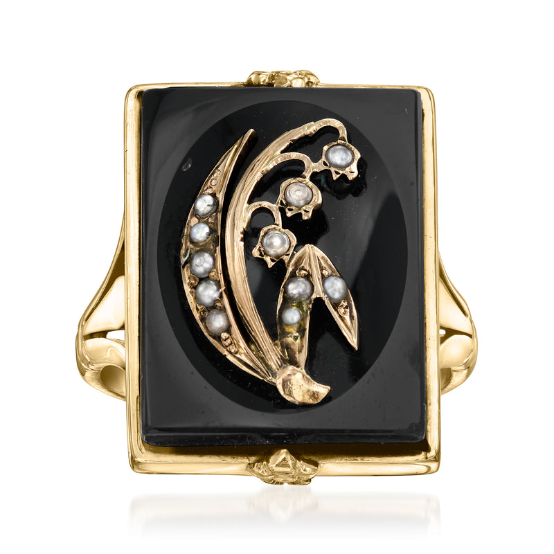 Vintage onyx ring in 14kt yellow gold with seed pearl accents and ornate floral design