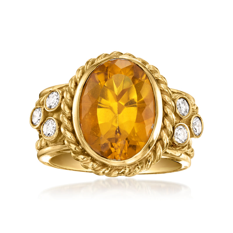 Oval citrine gemstone ring with diamond accents, set in yellow gold, vintage style