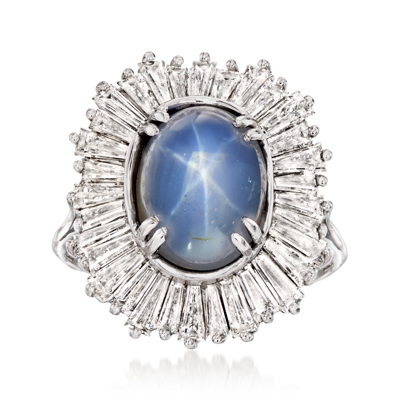 Platinum ring with oval blue star sapphire and diamond halo with baguette and round stones