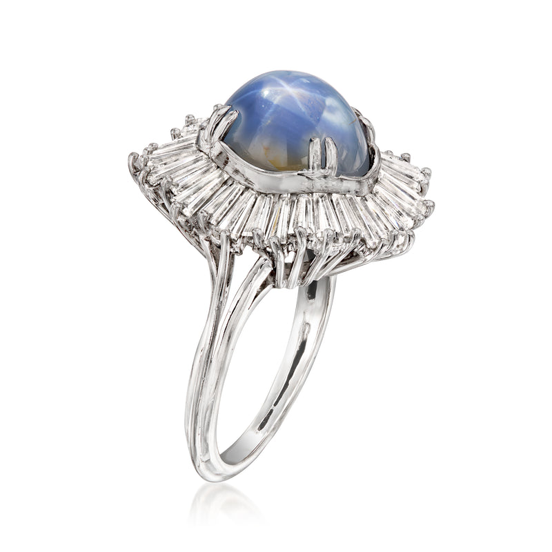 Side view platinum ring with oval blue star sapphire set in a diamond halo