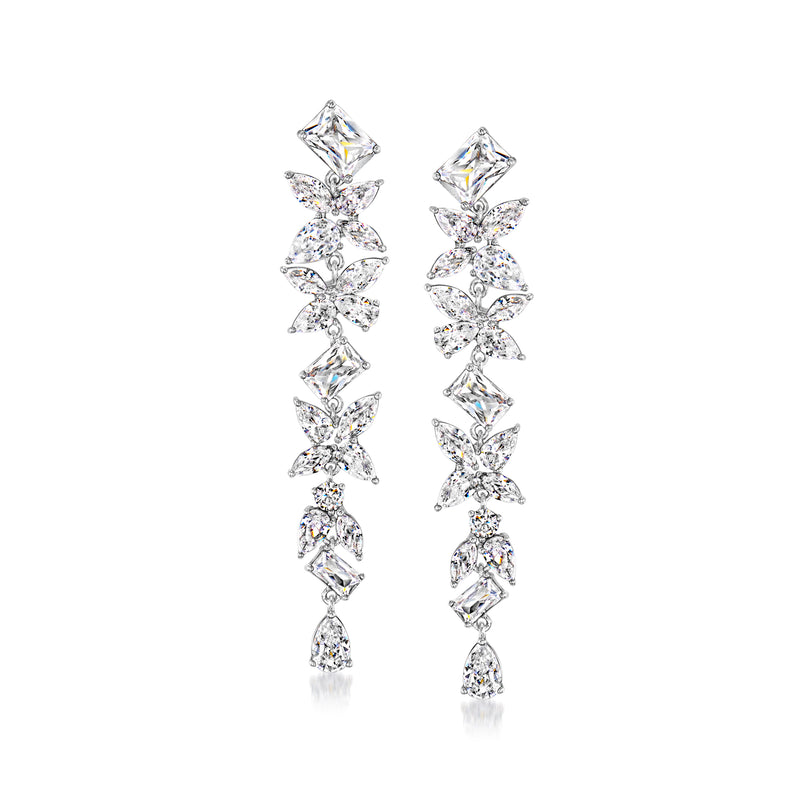 Rhodium-plated floral drop earrings with clear CZ clusters, long dangling design.