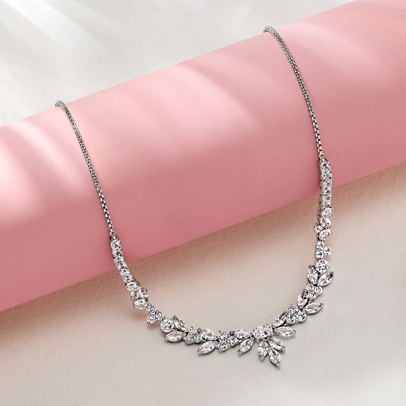 Rhodium-plated floral CZ necklace with marquise stone links and center flower drop