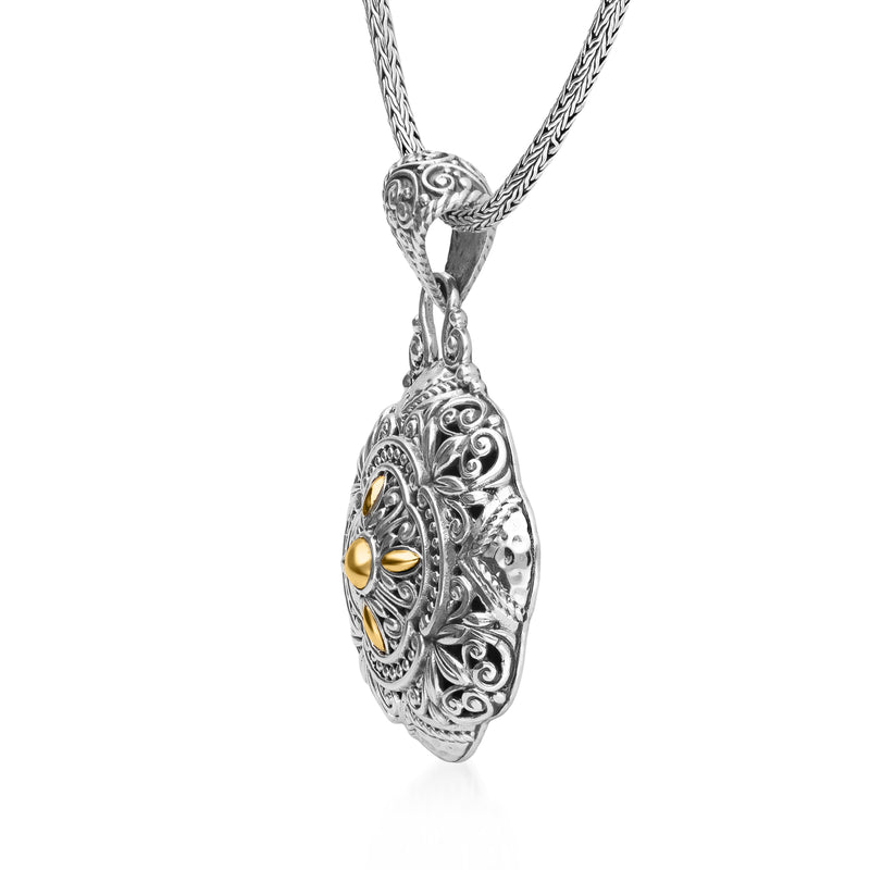 Bali-style floral pendant necklace, sterling silver oval pendant with yellow gold inlay