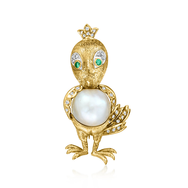 Gold bird pin with round pearl body, emerald eyes, and diamond accents