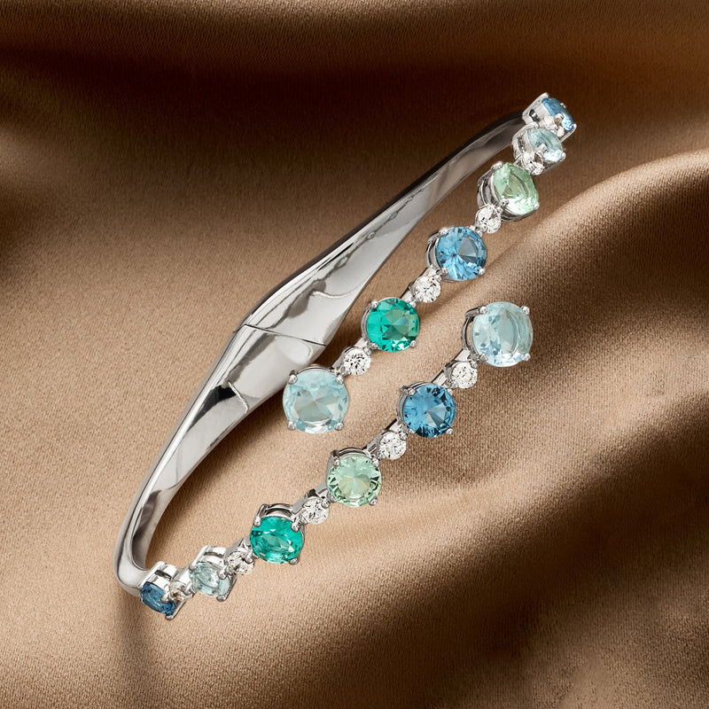 Rhodium-plated bypass bangle bracelet with blue and green round simulated stones