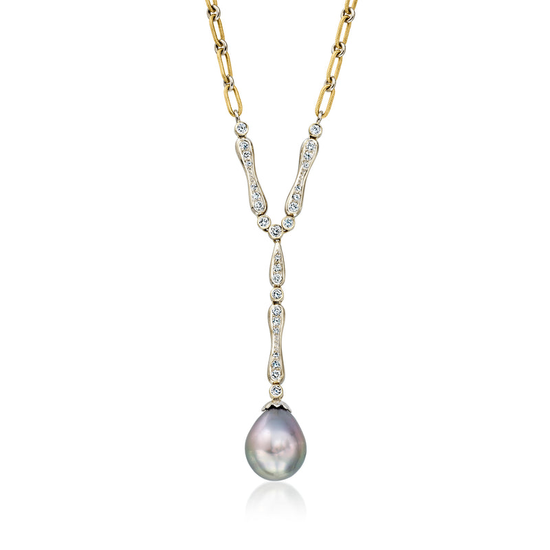 Two-tone gold Y-necklace with central pearl drop and diamond-accented V pendant