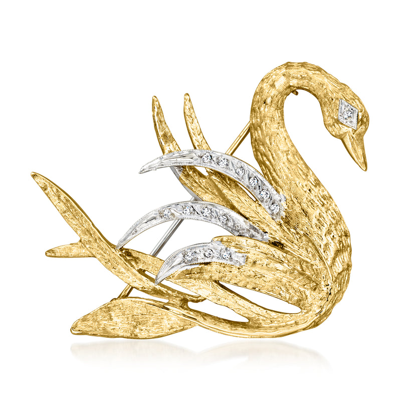 Two-tone gold swan pin with diamond-like accents, open-wing vintage design.