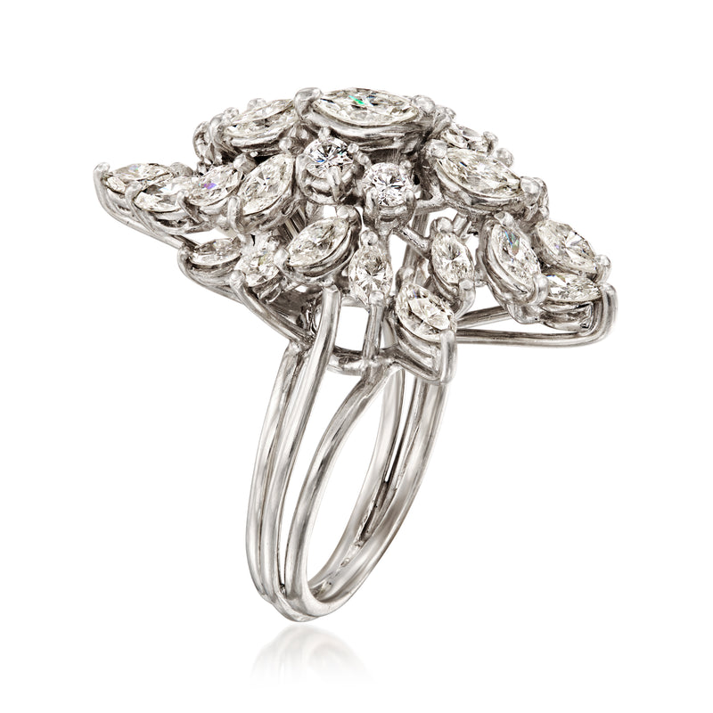 Platinum diamond cluster ring side view with prong-set marquise and pear stones