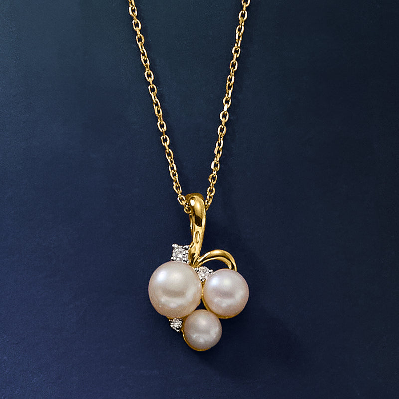 Gold pendant necklace with three white pearls and small diamond detailing