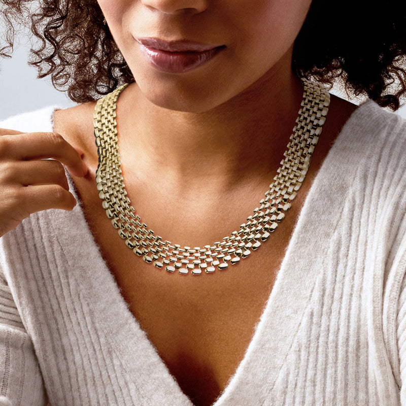 Gold-plated rectangular-link chain necklace worn close to the neck