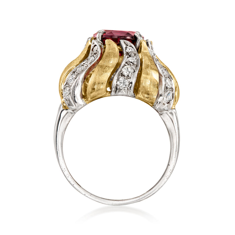 Top view of oval rhodolite garnet ring with diamond side stones in gold and platinum