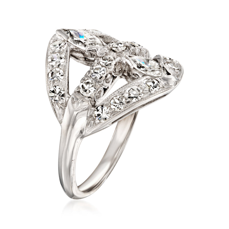 White gold diamond ring side view with pear-cut center stone and decorative openwork