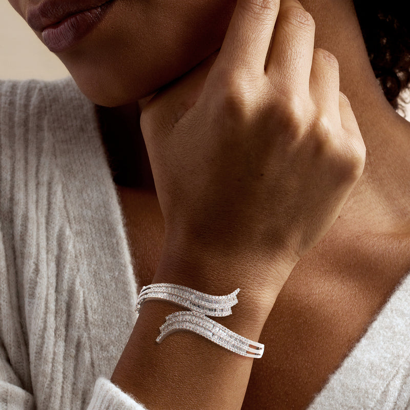 Vintage diamond bypass bangle bracelet in white gold on wrist