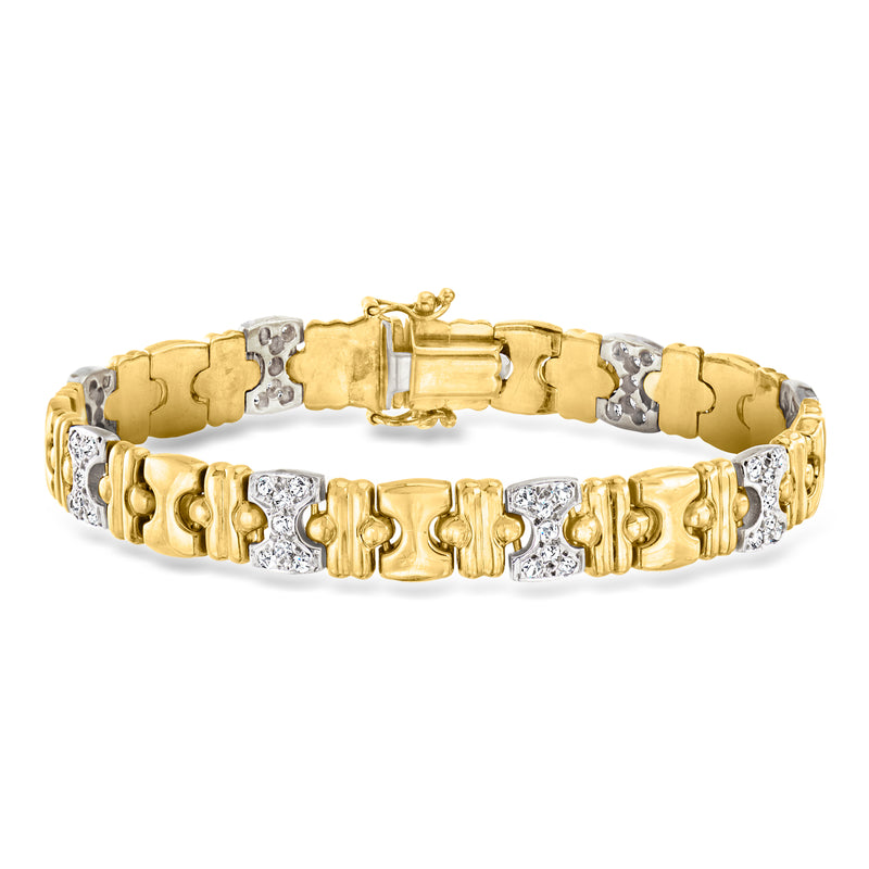Two-tone 14kt gold diamond station bracelet with alternating white-gold settings and clasp.