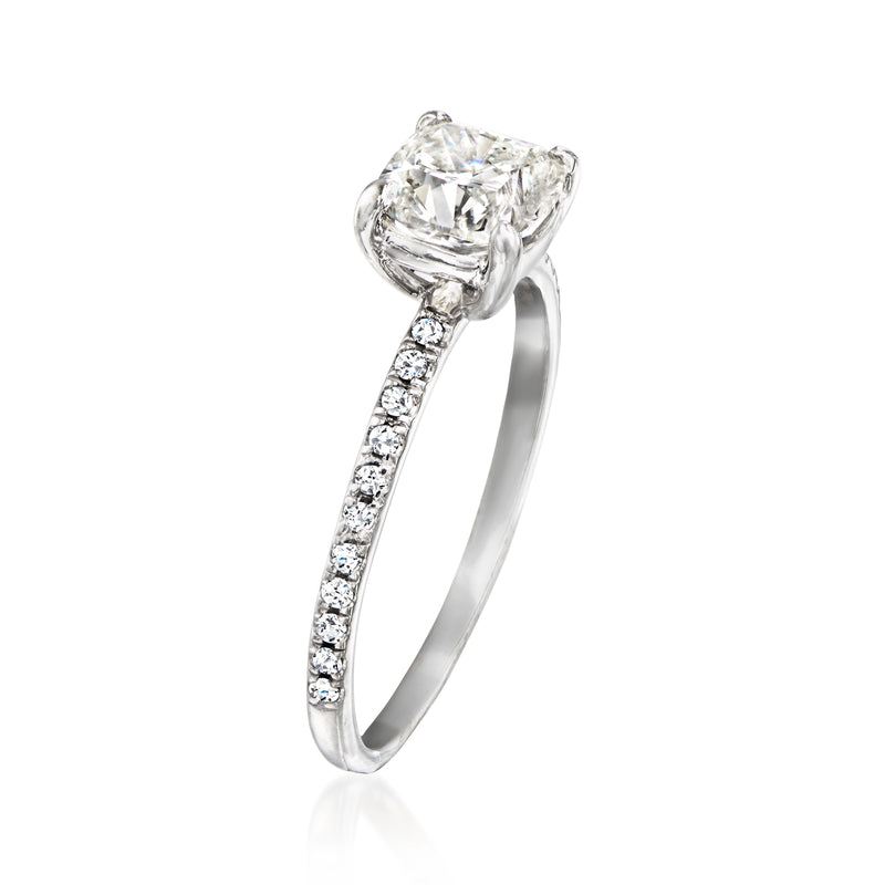 Vintage diamond ring in white gold with cushion-cut center stone and pavé band