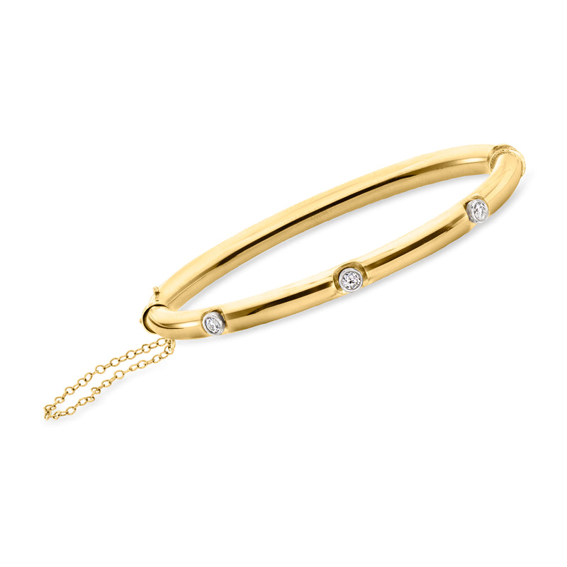Vintage 14kt yellow gold diamond three-stone bangle bracelet with three round stones
