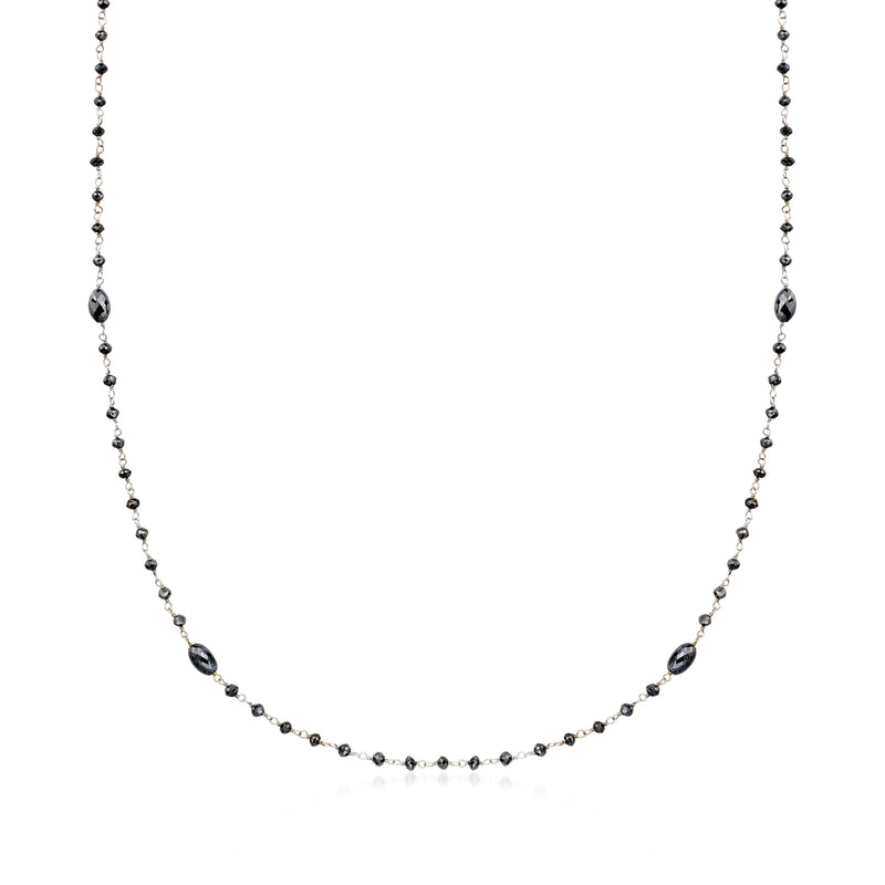 White gold bead station necklace with dark diamond stations and small round links