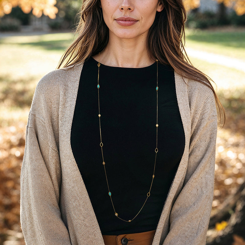 18kt yellow gold station necklace with howlite and diamond accents, worn on model