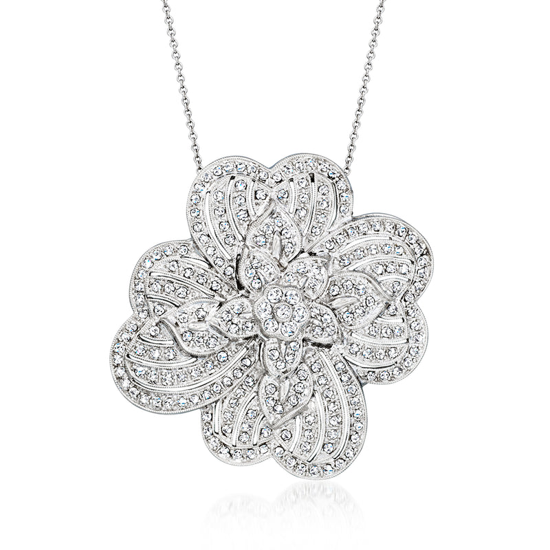 Diamond flower pendant necklace in white gold with pave-style round stones, on a chain