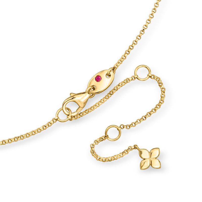 Yellow gold flower station necklace close-up with diamond accents and small stone