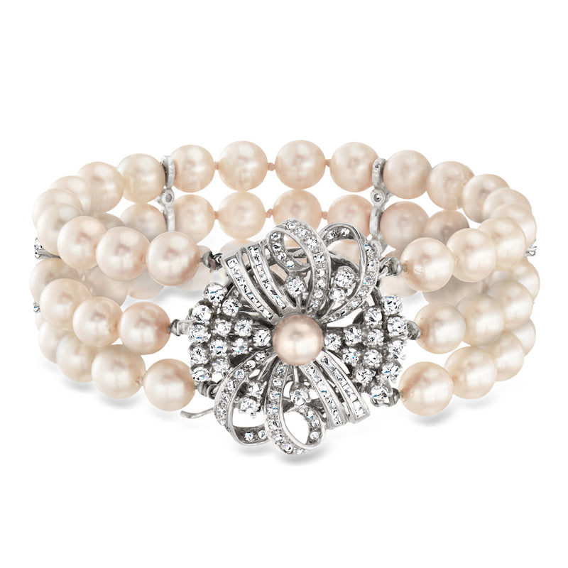 Cultured pearl bracelet with diamond flower clasp in white gold, round pearl strands