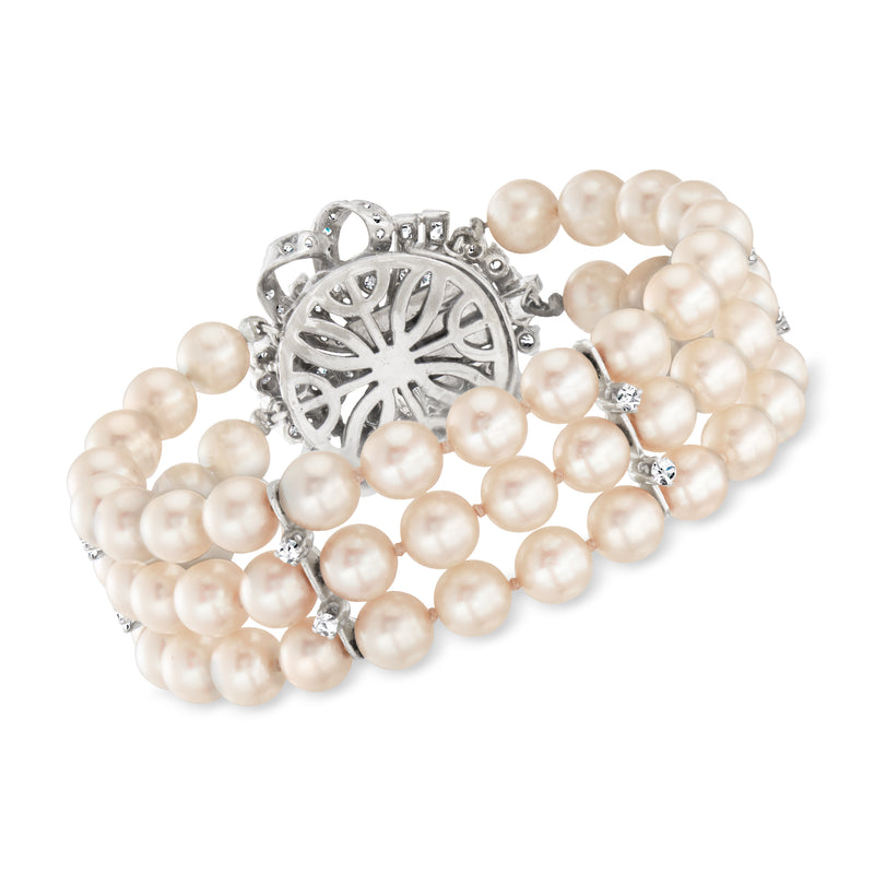 Cultured pearl bracelet with round diamond flower center, white gold settings and strands